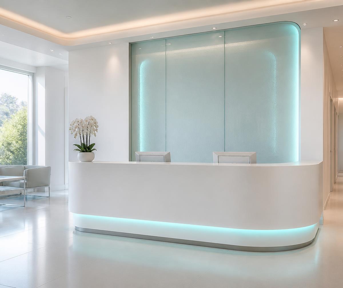 Frosted glass reception desk with soft teal lighting
